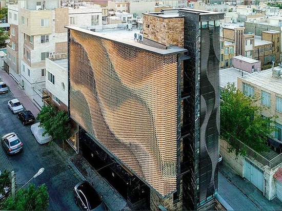 A rippling brick façade in Iran offers privacy from onlookers without blocking natural light