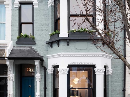 A Glass Enclosed Extension Brings New Light Into This Home