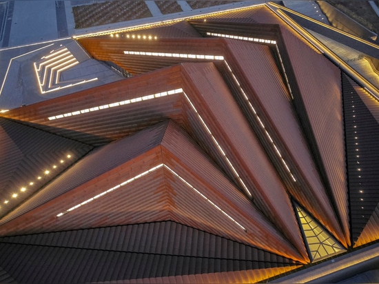 a clerestory between each volume creates a naturally lit interior during the day, while creating a unique beacon for the new cultural quarter at night