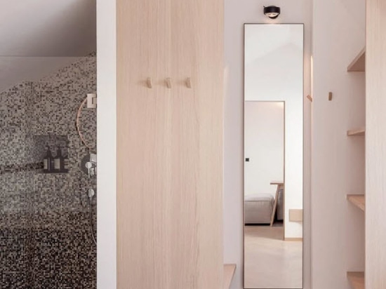 Bathrooms and washroom feature mosaic tiles in varying shades of gray