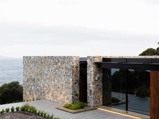 The Stone Walls Found Throughout This House Are Designed To Complement The Landscape