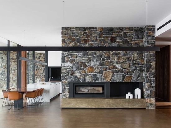 The Stone Walls Found Throughout This House Are Designed To Complement The Landscape