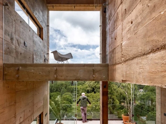 The upper-most apartment has a small mezzanine in the double-volume living area