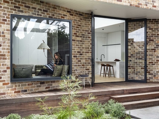 The Angled Brick Walls Of This Home Allow For A Window Seat In The Living Room