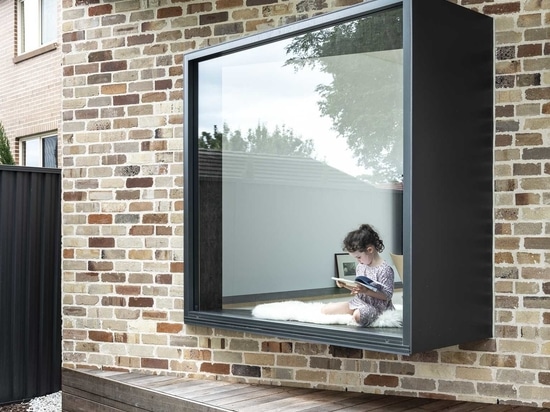 The Angled Brick Walls Of This Home Allow For A Window Seat In The Living Room