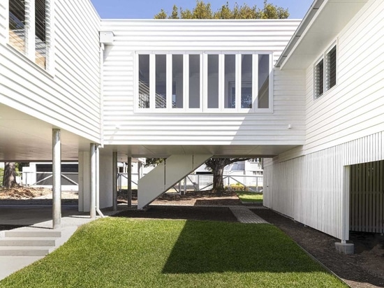 An Elevated Walkway Connects The Original House With A New Extension