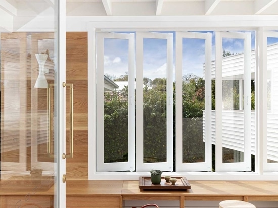 An Elevated Walkway Connects The Original House With A New Extension