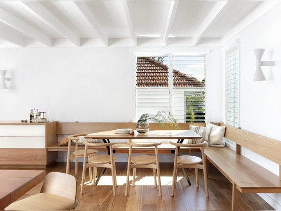 An Elevated Walkway Connects The Original House With A New Extension