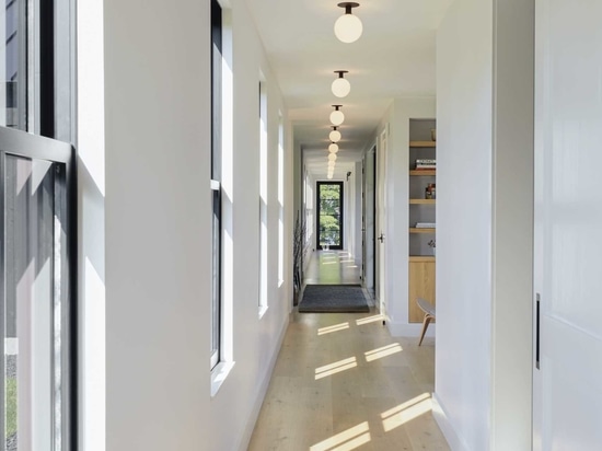 Separate Living Areas Of This Home Are Connected By A Central Hallway