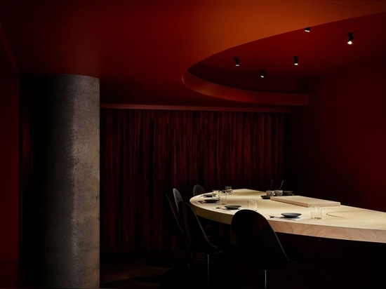 A private dining room envelopes diners in vermillion.