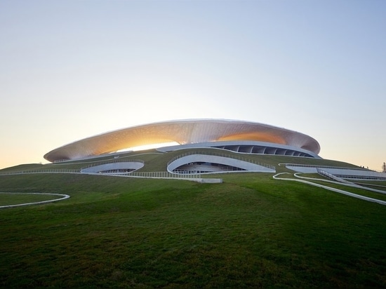 MAD Architects' newly-completed Quzhou Sports Park hovers over the Zhejiang Province in China