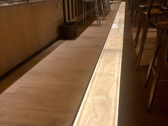 Installation of luminous floor tiles in the restaurant of the Brach Paris hotel.