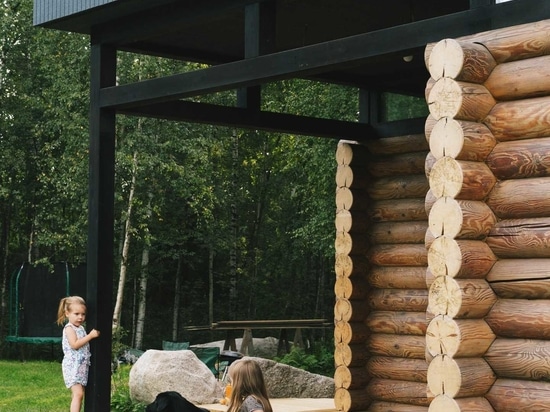 A Pile Of Logs From An Old House Were Used To Create The Bottom Half Of This New Home