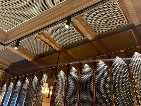 Banker Wire M22-83 Brass wire mesh installed as cabinet screen for Beirut Café in Stockholm Sweden