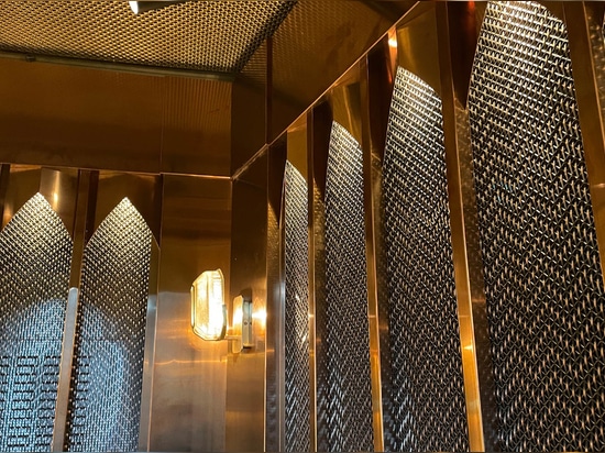 Banker Wire M22-83 Brass wire mesh installed as cabinet screen for Beirut Café in Stockholm Sweden