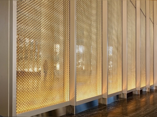 Banker Wire's M22-80 in stainless steel and brass clad against mirrors in the Frost Bank Tower lobby creates a beautiful sparkle and visual interest.