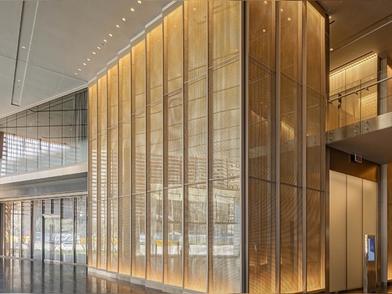 Banker Wire's M22-80 in stainless steel and brass clad against mirrors in the Frost Bank Tower lobby creates a beautiful sparkle and visual interest.