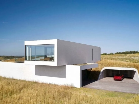 BIG completes slithering Villa Gug on the countryside hills of northern Denmark