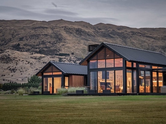 A Material Palette Of Cedar, Stone, And Metal Contribute To The Charm Of This Farmhouse-Inspired Home