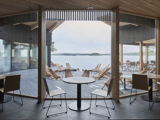 Natural And Blackened Wood Create A Contrasting Design For This Restaurant And Sauna