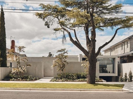 Concrete walls wrap around the exterior of the house