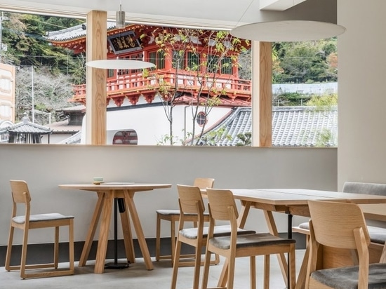 Wooden furniture matches the pared-down interior