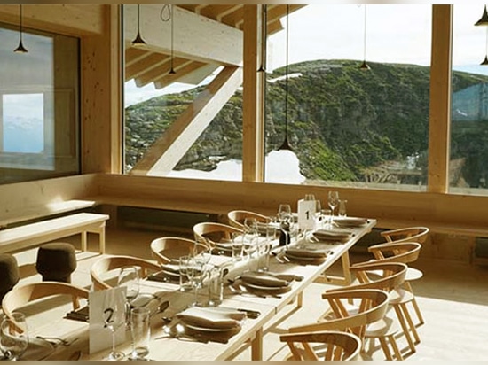 the humble structure and furniture sits well amongst the unspoiled mountainous landscape