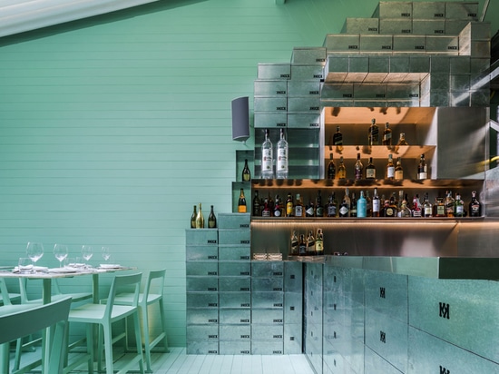 zinc shoeboxes comprise the shelving and counter bar area of the eatery