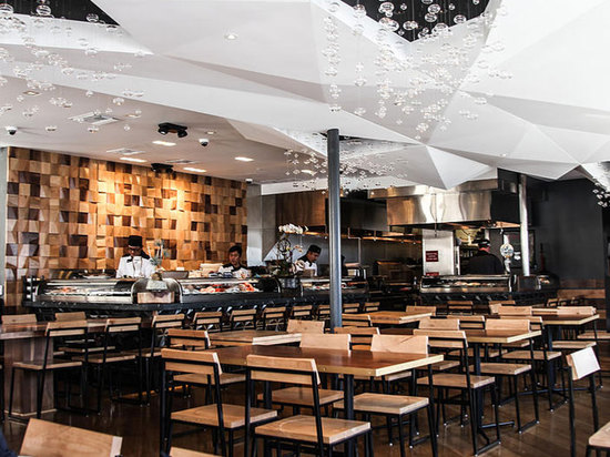 the origami ceiling is highlighted by the floating air bubbles