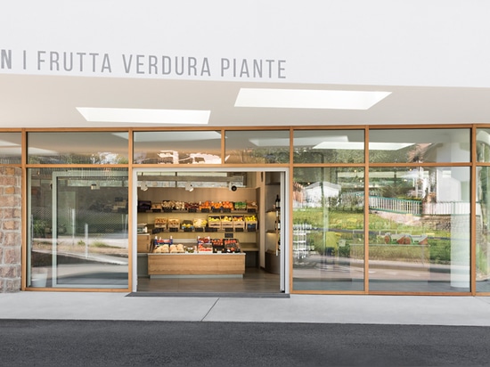 the shelves for the food display are made of stainless steel and the counter is sawn larch wood