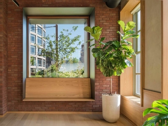 Wood interior elements soften the brick walls.