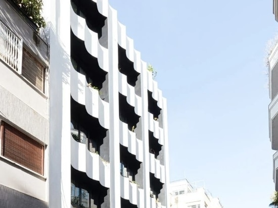 the playful white facade embraces only the middle levels of the hotel