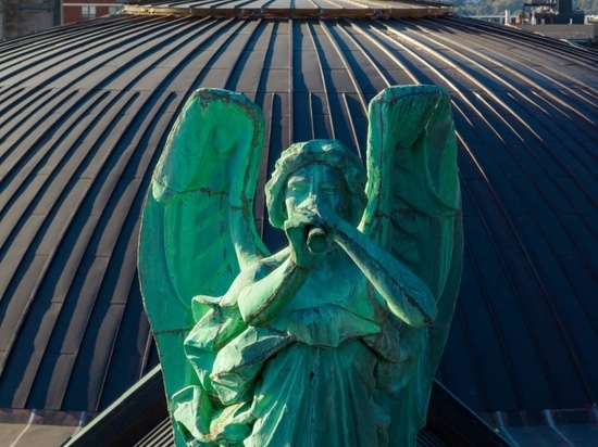 Over time the copper of the dome will patina to the same color as the statue of the angel Gabriel.