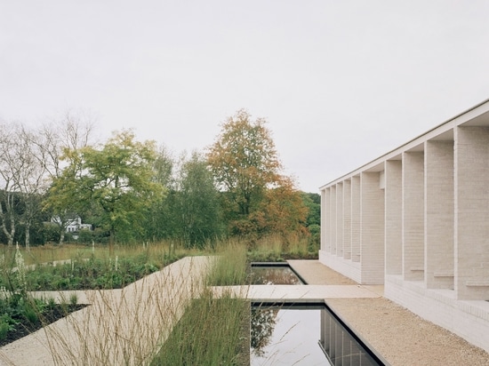 Reflective pools sit outside