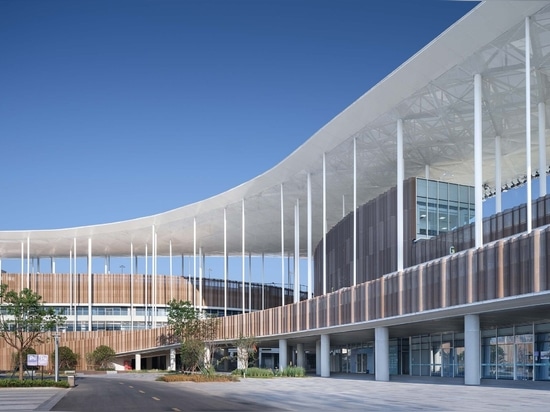 Cloud-like winged roof floats above UAD's asian games sports cultural center in Shaoxing