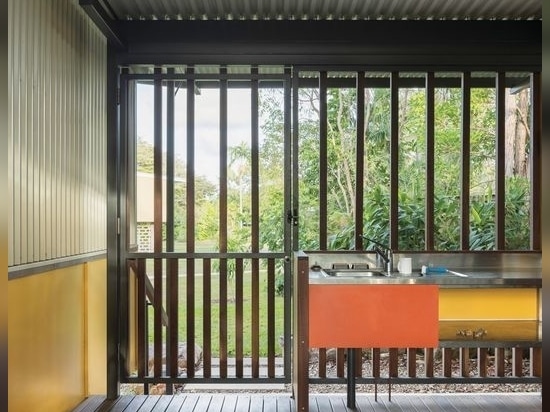 Timber balustrading and unlined eaves lend the communal area a simple elegance.