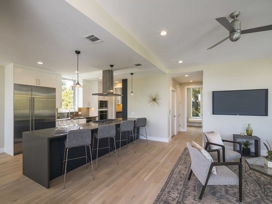 Open plan living area, dining space and kitchen of the modern Austin home