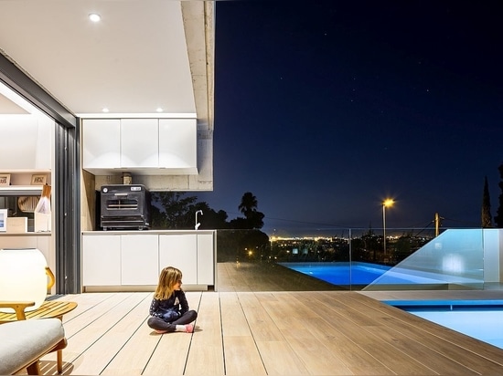 Indoor and outdoor kitchens along with barbecue area on the porch