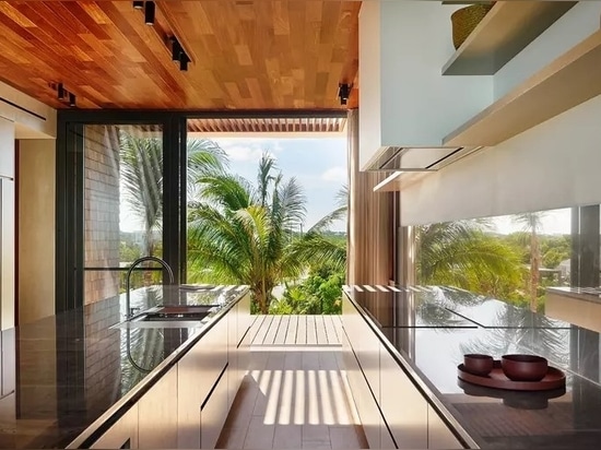 Bay House turns towards its idyllic views of palm trees and blue ocean