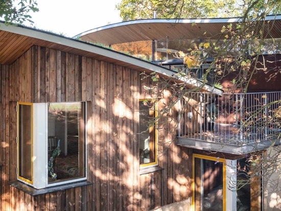 Curved Green Roofs Cover This Creekside Cabin