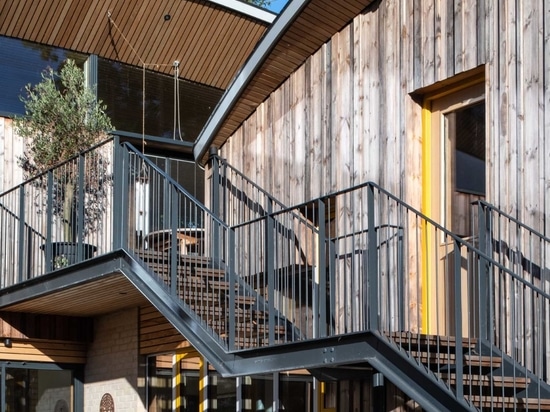 Curved Green Roofs Cover This Creekside Cabin