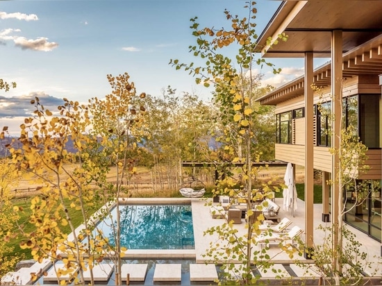 Clad In Stone, Wood, Steel, And Glass, This House Nestles Quietly Within The Natural Surroundings