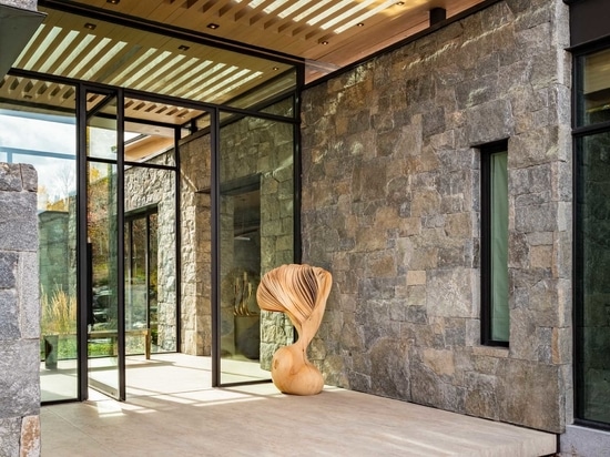 Clad In Stone, Wood, Steel, And Glass, This House Nestles Quietly Within The Natural Surroundings