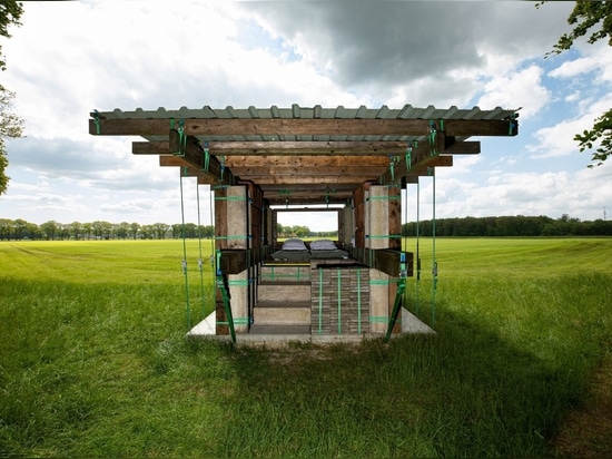 Stable Stack is a temporary hotel room with a view of farmland