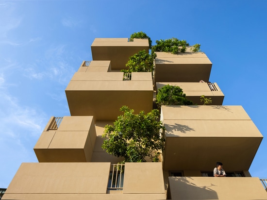 TAA design shapes living complex in Vietnam as a matrix of flying blocks & large trees