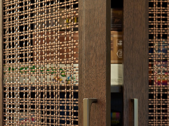 The Banker Wire SJD-21 in an Antique Copper finish conceals the shelving just enough to create a uniform look while still being able to locate your game of choice quickly.