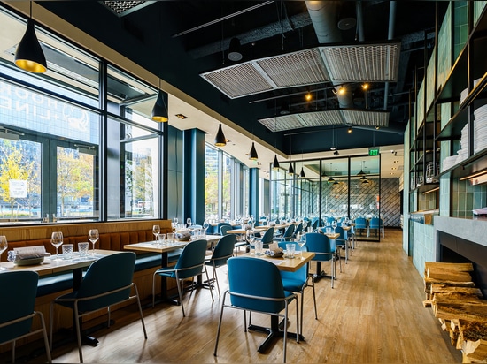 The Banker Wire Dune 4050 flexible wire mesh pattern in stainless steel installed to look like a fishing nets featured in the Hook + Line restaurant.