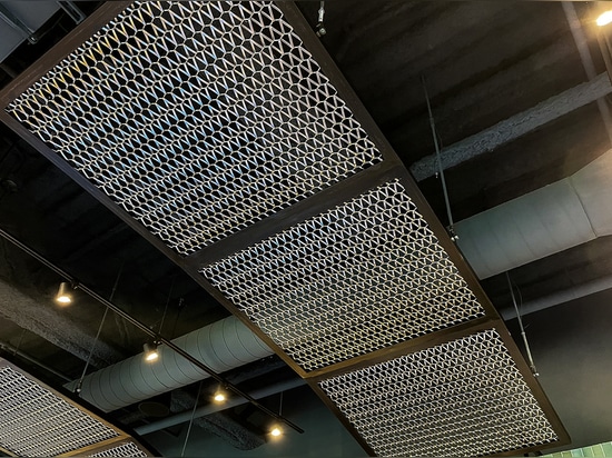 The Banker Wire Dune 4050 flexible wire mesh pattern in stainless steel installed to look like a fishing nets featured in the Hook + Line restaurant.