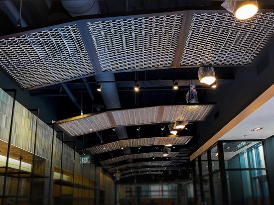 The Banker Wire Dune 4050 flexible wire mesh pattern in stainless steel installed to look like a fishing nets featured in the Hook + Line restaurant.