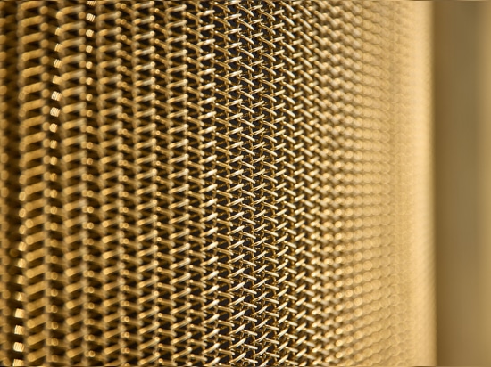 Wake up your walls with a brass-plated metal mesh.